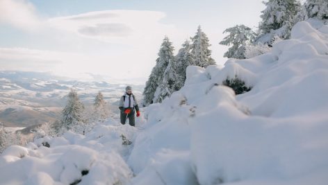Female hiker in the snow